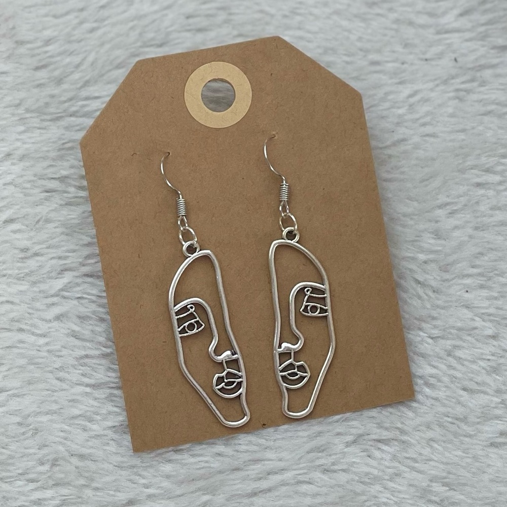 Face earrings 2/$20